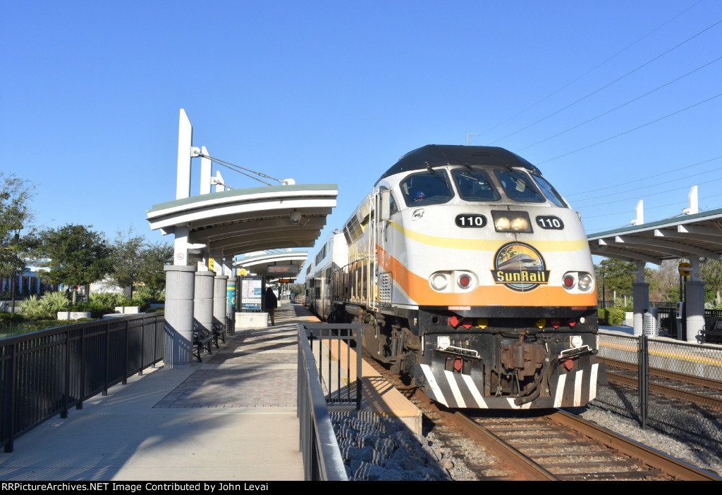 Sunrail Train # P312 leaves Poinciana Depot behind MP32PH-Q # 110 heading to DeLand by way of Downtown Orlando